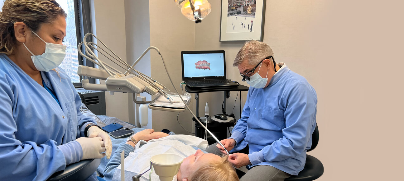 Dr. Graffeo and Dental Assistant Silvia at work improving smiles